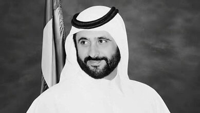 Black and white portrait of Sheikh Ahmed Al Maktoum in traditional attire.