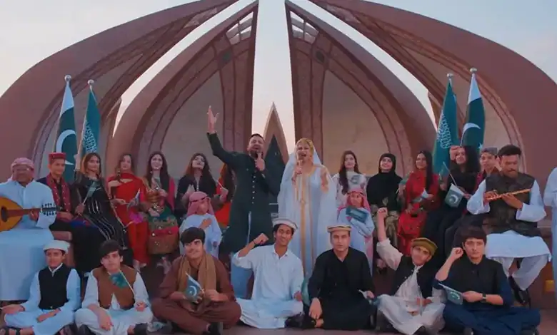 Group of people in traditional attire celebrating Saudi National Day with music and dance.