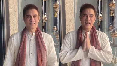 Faissal Khan in traditional attire with hands folded in greeting during Janmashtami celebrations.