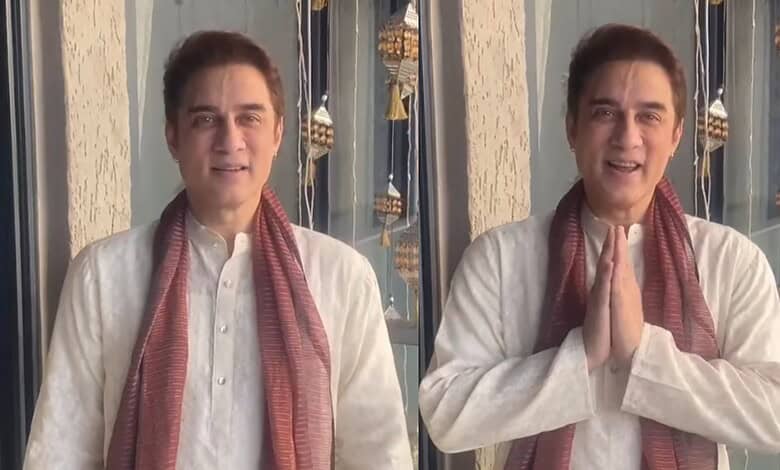 Faissal Khan in traditional attire with hands folded in greeting during Janmashtami celebrations.