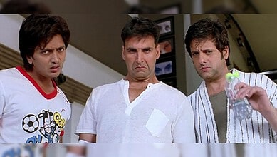 Three men with confused expressions in a home setting, one holding a water bottle.