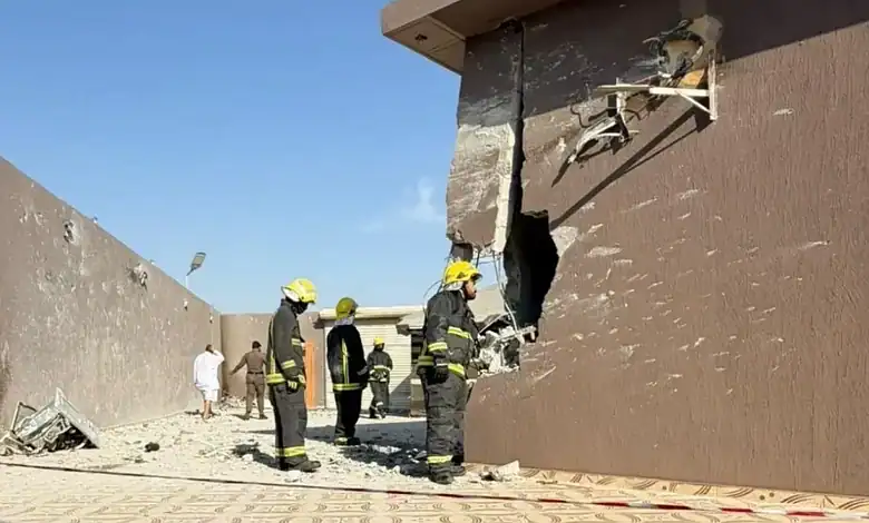 Firefighters inspect damage after Houthi drone debris caused casualties in Saudi Arabia.