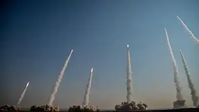 Iranian ballistic missiles launched into the sky during an earlier attack.