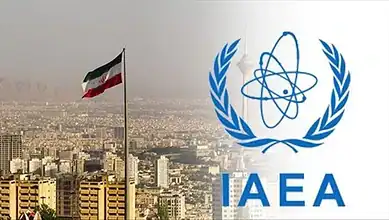 The IAEA logo and the Iranian flag fly over Tehran's cityscape in this image.