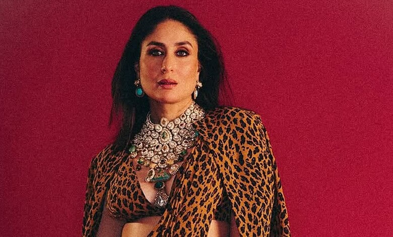 Kareena Kapoor wearing a leopard print dress with jewelry against a red background.
