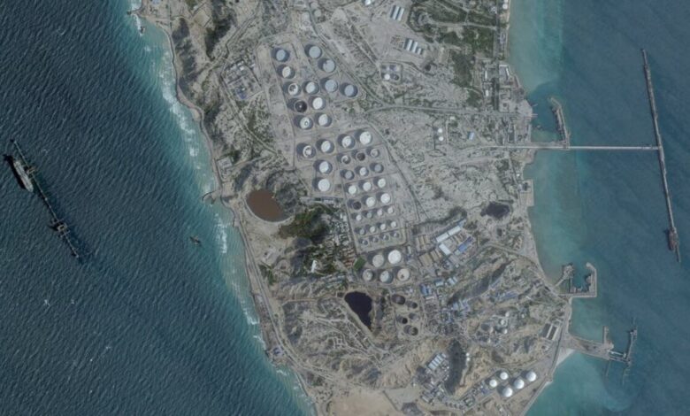 Aerial view of Kharg Island oil terminal with storage tanks and port facilities in the Persian Gulf.