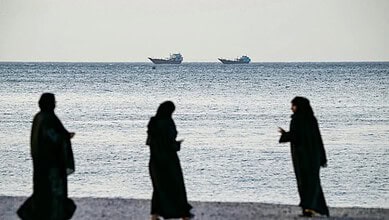 Two ships near Oman in the Strait of Hormuz with three projectiles hitting a tanker.