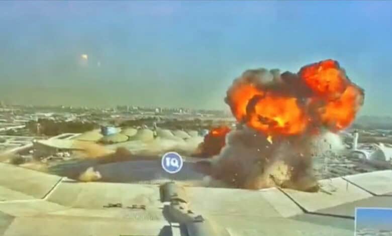 Fire and smoke rise after a strike at Kuwait International Airport.