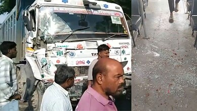 Hyderabad RTC bus damaged after collision with lorry, several people present at scene.