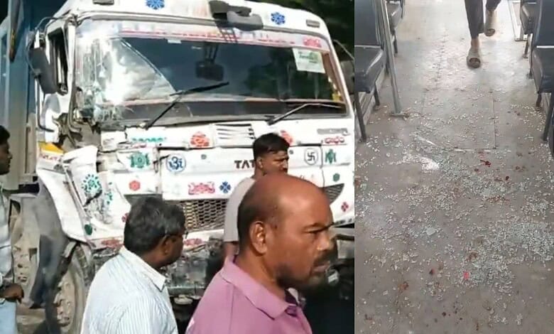 Hyderabad RTC bus damaged after collision with lorry, several people present at scene.