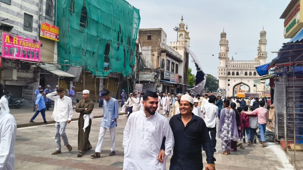 People gather at Makkah Masjid in Hyderabad for Friday prayers amid high security.