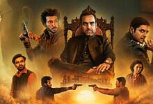 Promotional poster of Mirzapur featuring main characters with guns and intense expressions.