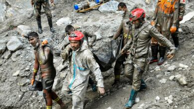 Nepal Army personnel recover a body during an ongoing joint and rescue operation from the tunnel of Chilime Hydropower Project following the devastating flash floods, in Rasuwa district, Nepal. (Handout via PTI Photo)