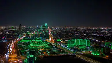 Riyadh skyline illuminated at night.