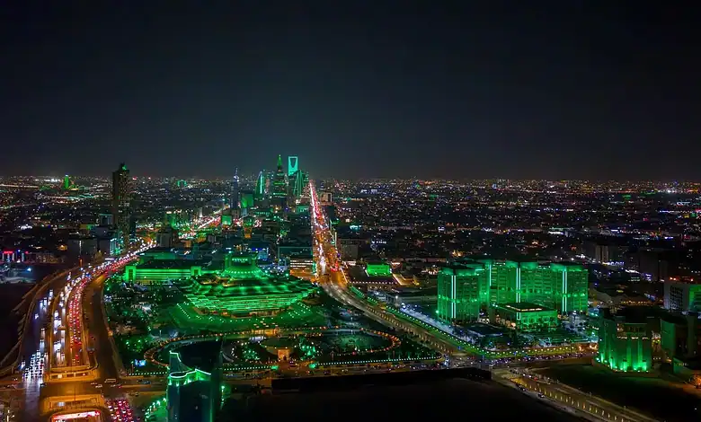 Riyadh skyline illuminated at night.