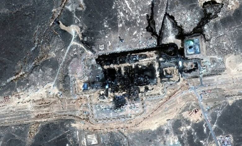 Burnt pipeline with visible damage and surrounding scorched earth in an industrial area.