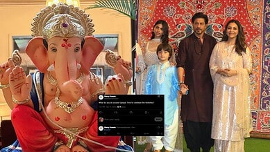 Family celebrating Ganesh Chaturthi with a large Ganesha idol and traditional attire.