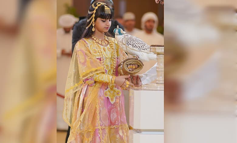 Shaikha Al Mansoori holds a rare white falcon at ADIHEX 2026 in Abu Dhabi.