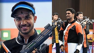 Indian shooter celebrating after winning silver in men's 10m air rifle at Asian Games.