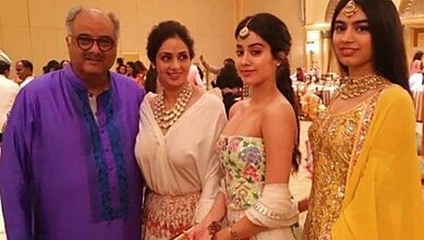 Four people, including Boney Kapoor and two women, dressed in traditional Indian attire at an event.