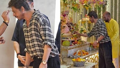 Shah Rukh Khan at a religious ceremony wearing a checkered shirt and a gold watch.