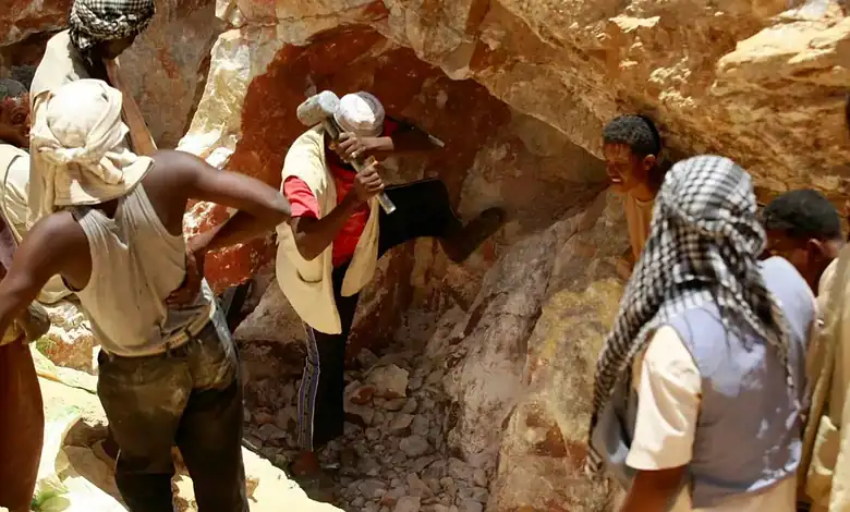 Group of rescue workers and villagers at the site of a gold mine collapse in Sudan.