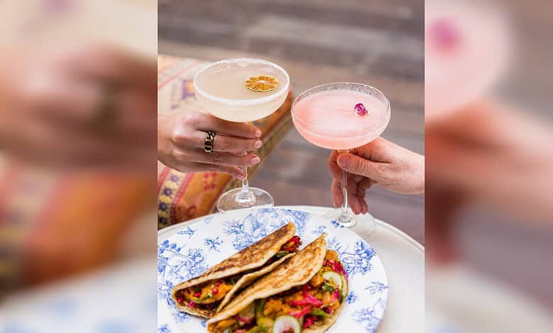 Two cocktails and a plate of Indian food at Tandoor Tina restaurant in Dubai.