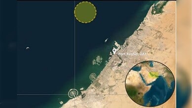 Vessel appears to be listing after possible attack near Port Rashid, UAE.