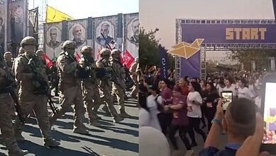 Iranian women run during Tehran 10K as Guards march.