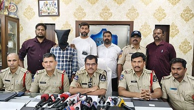 Police officers and officials during a press conference on laptop thefts.