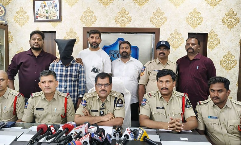 Police officers and officials during a press conference on laptop thefts.