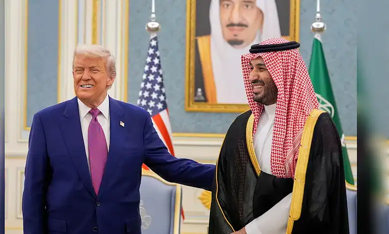 President Trump and Saudi official smiling during diplomatic meeting in ornate room.