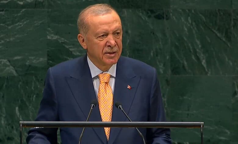 Turkish President speaking at UN General Assembly with green background.
