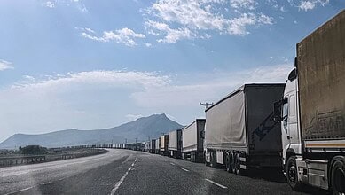 Long line of trucks waiting at the Turkiye-Iran border amid blockade.