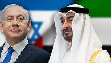 UAE President and Israeli leader in discussion, with flags in the background, during a diplomatic event.