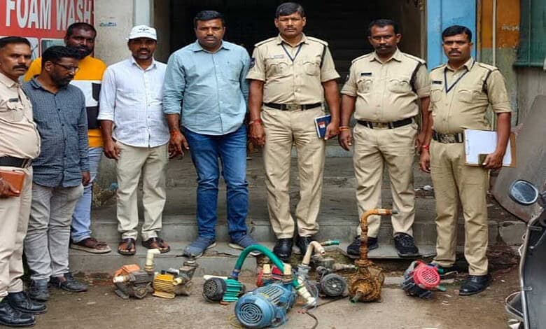 HMWSSB officials with seized illegal water motors in KPHB during crackdown.