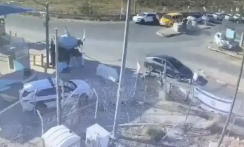 Vehicles involved in a ramming attack in the West Bank, with police and emergency response present.