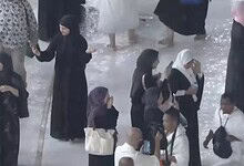 Worshippers brave heavy rain at the Grand Mosque in Makkah during prayer.