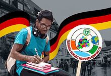 Young man protesting in Germany with flags and a logo of a workers' union.