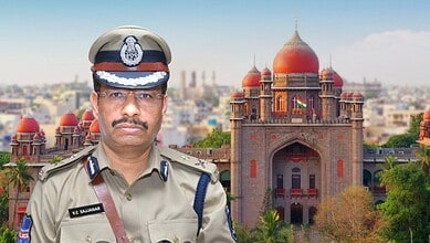 Police officer in uniform with historic building in background, Telangana, India.
