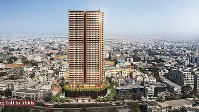 Tall 35-floor Abids tower in Hyderabad with cityscape background.