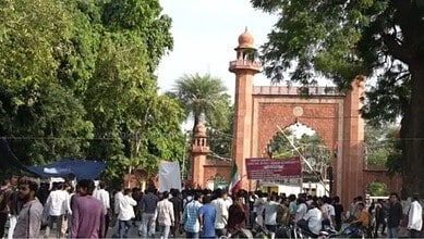 Students gather outside the historic gate of Aligarh Muslim University during elections.