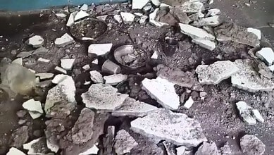 Debris and broken plaster on the ground after a fall at Anganwadi.