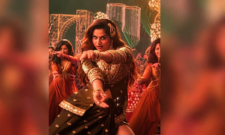 Ayesha Khan dancing on stage during her live 'Shararat' performance in Hyderabad.