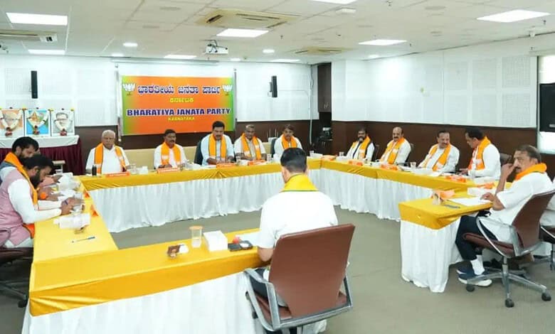 Political meeting with leaders seated around a U-shaped table in a conference room.