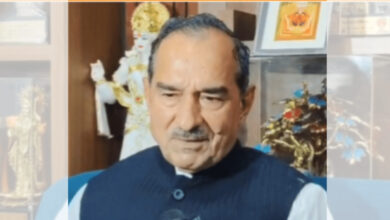 Rajasthan BJP chief appears contemplative, with religious artifacts in the background.