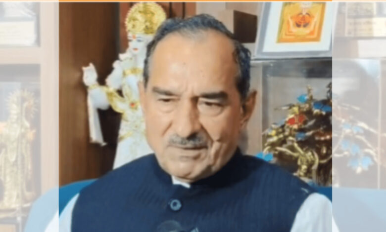 Rajasthan BJP chief appears contemplative, with religious artifacts in the background.
