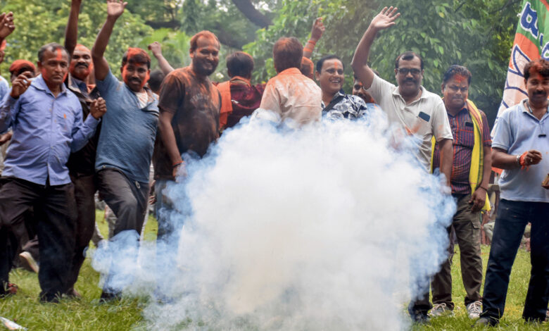 BJP supporters celebrate victory in Nandigram and Rejinagar.