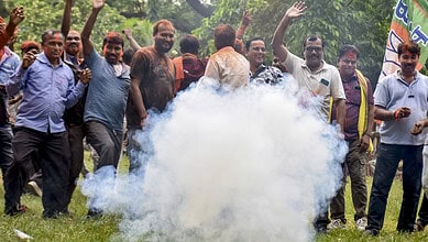 BJP supporters celebrating in Rejinagar during political rally with smoke and enthusiasm.