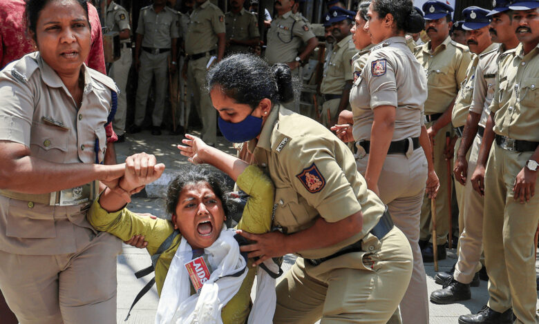 Police detain protesting students during march to Election Commission office in Bengaluru.